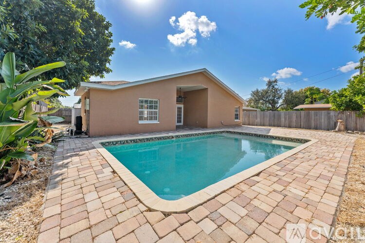 A house with a pool in the backyard.