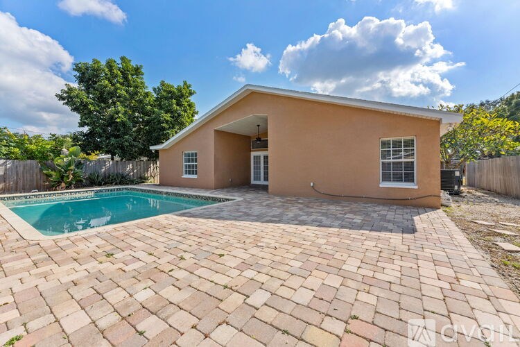A house with a pool in the backyard.