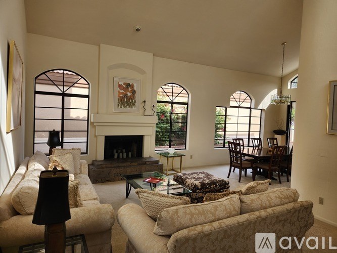 A living room with a fireplace and a couch.