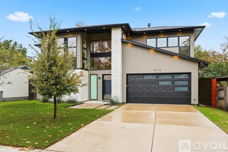 A modern house with a garage and a driveway.