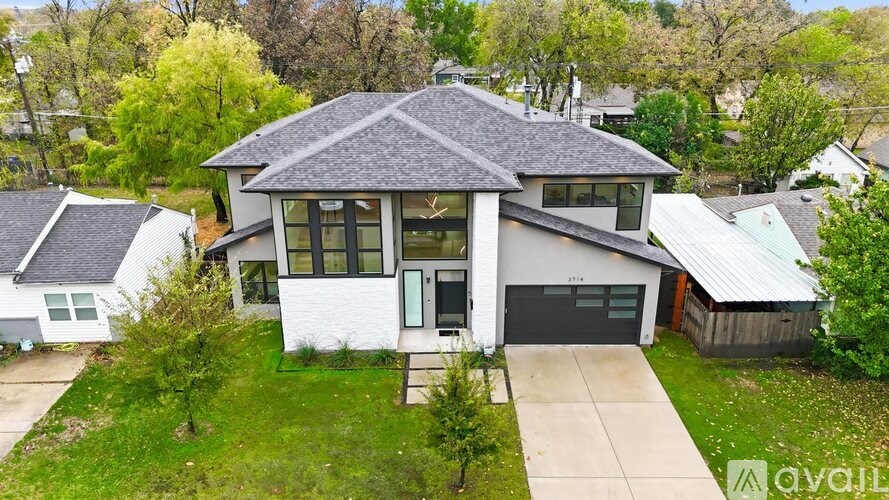 A house with a garage is for sale.