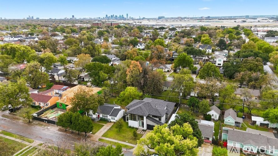 A residential area with houses and trees.