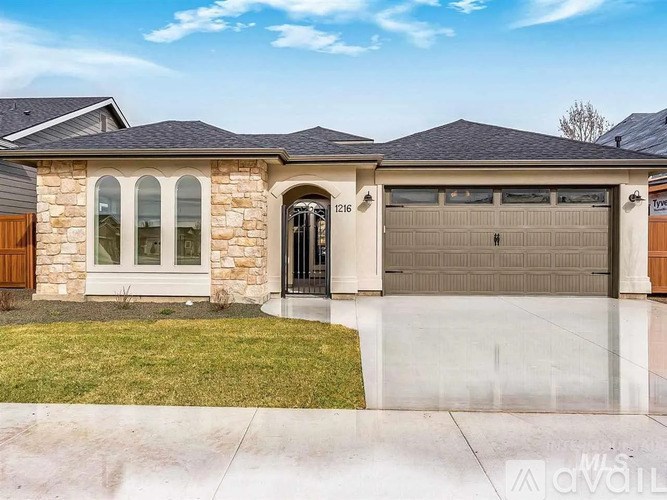 A house with a stone facade and a black roof.