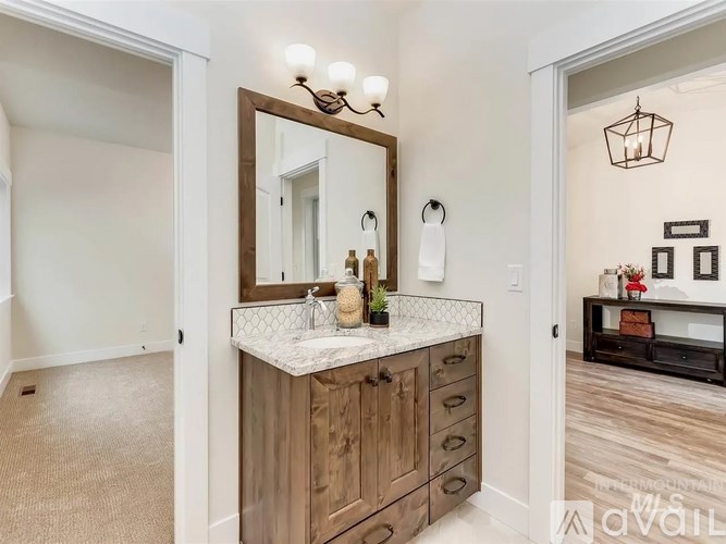 A bathroom vanity with a mirror above it.