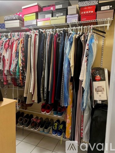 Clothes hanging on a rack in a store.