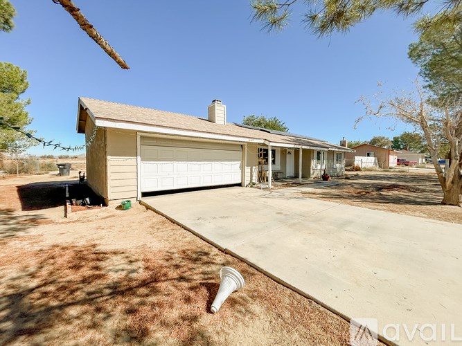 A house with a driveway in front of it.