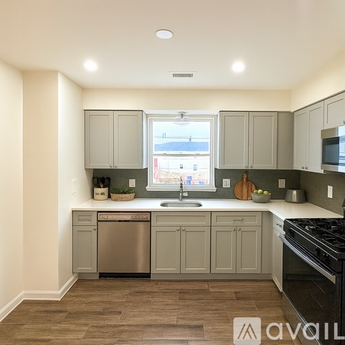 A kitchen with a window and a sink.
