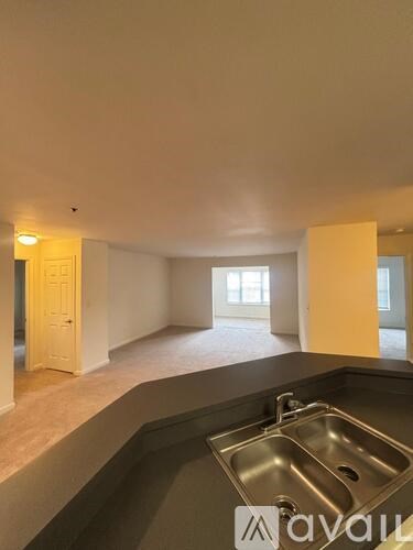 A kitchen with a sink and a window.