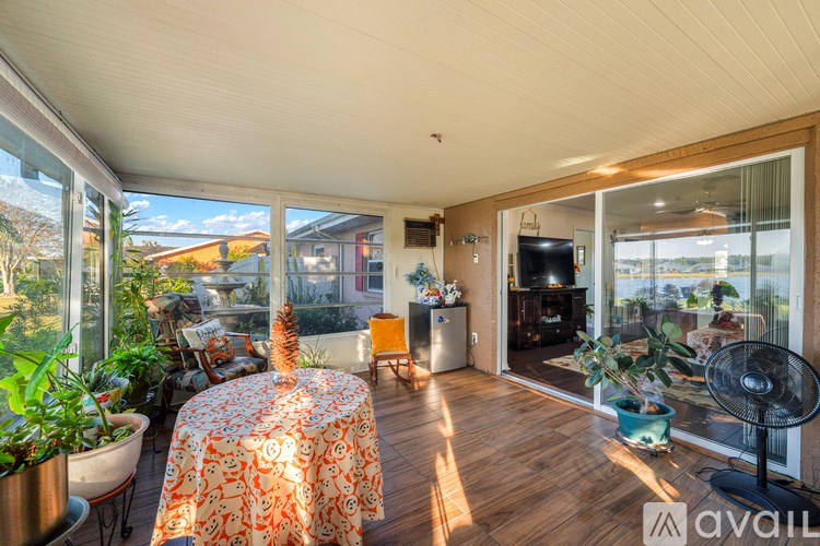A sunny patio with a table and chairs.