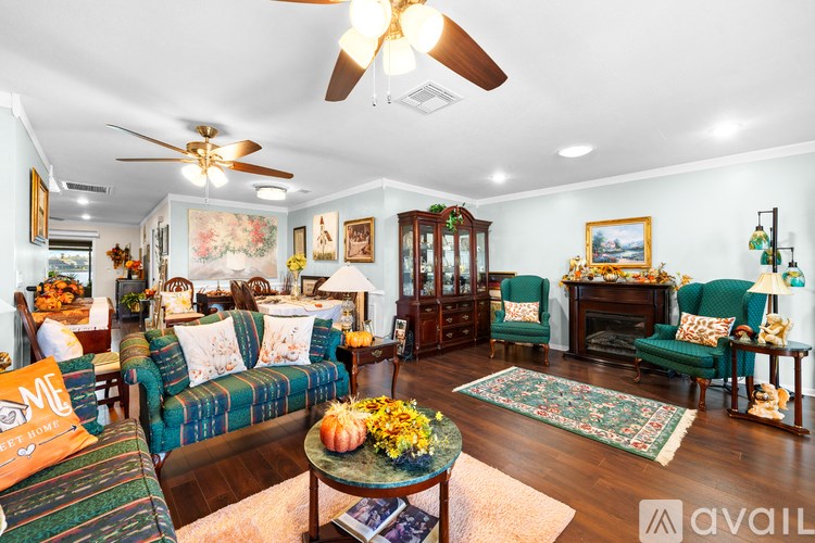 A living room with a sofa, chairs, and a coffee table.