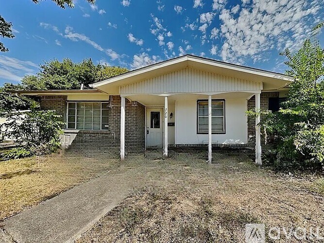 A house with a white front porch and a covered entrance.