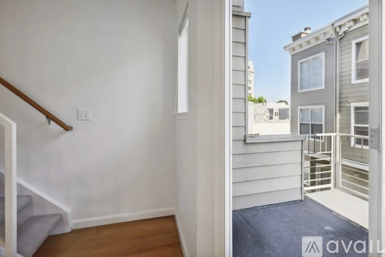 A room with a staircase leading to the upper floor.