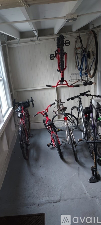 A bike shop with bikes hanging on the wall.