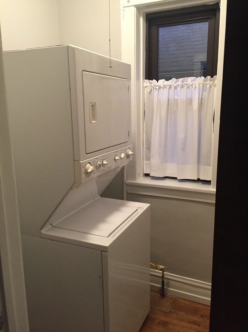A white oven and stove top in a kitchen.