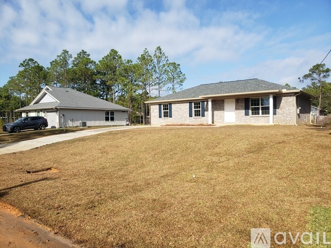 A house with a grey roof and a car parked in front.