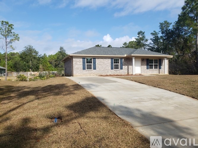 A house with a driveway in front of it.