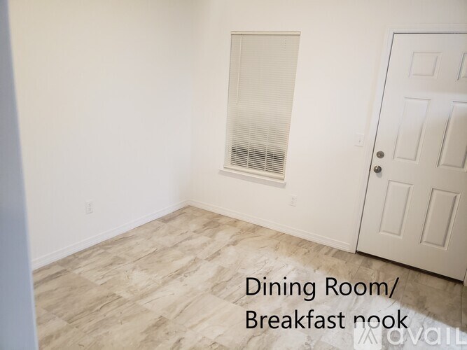A dining room with a breakfast nook.