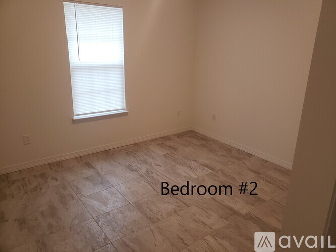 Bedroom #2 is empty and waiting to be furnished.