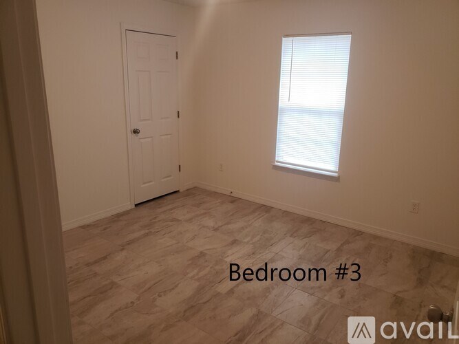 Bedroom #3 is empty and waiting to be furnished.