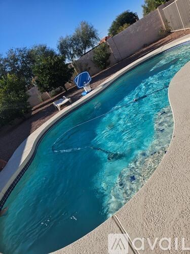A swimming pool with a blue float in the middle.