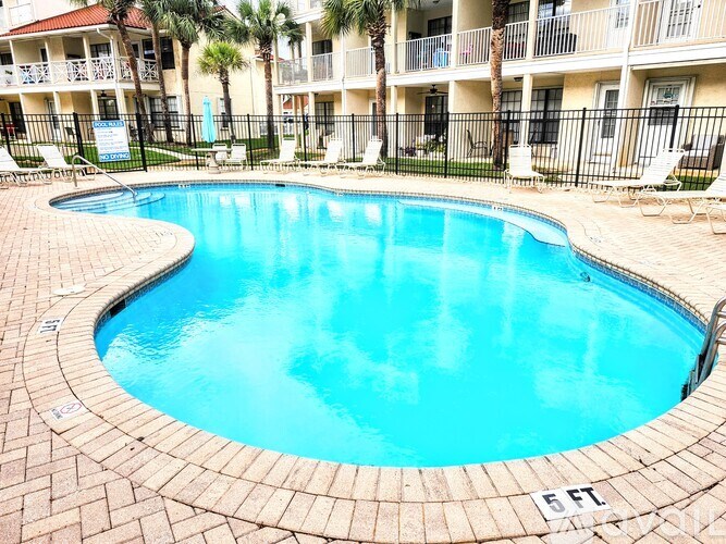 A small pool with a 5 ft depth marker.