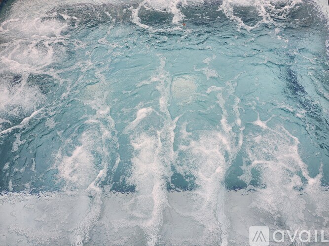 A close up of a frozen surface with a lot of white and blue patterns.