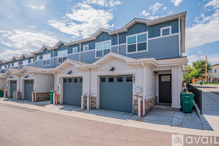 A row of houses with garages are available for rent.
