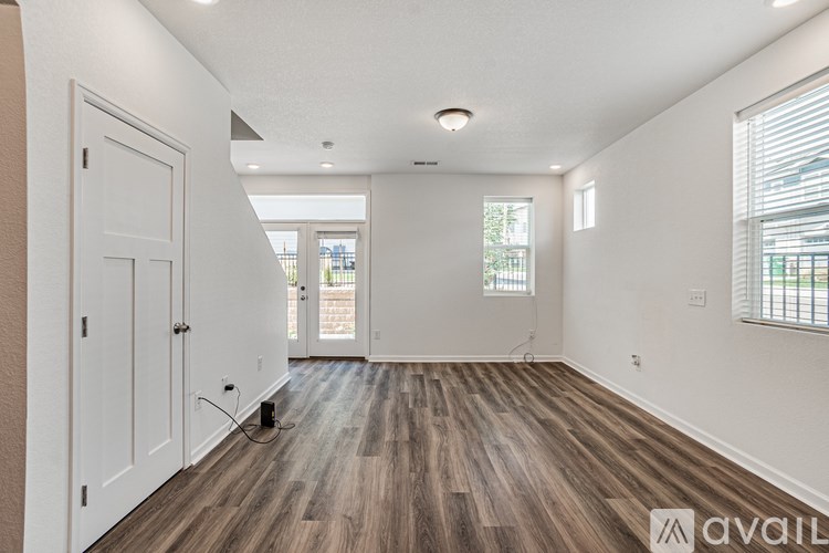 A room with wooden floors and white walls.