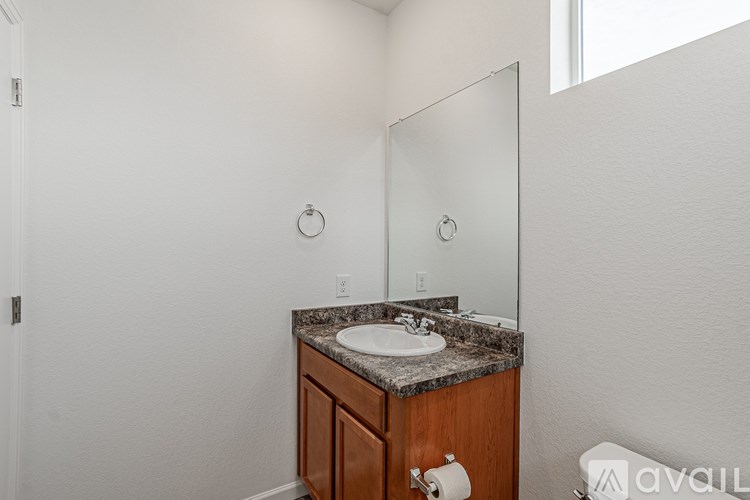 A bathroom with a sink and mirror.