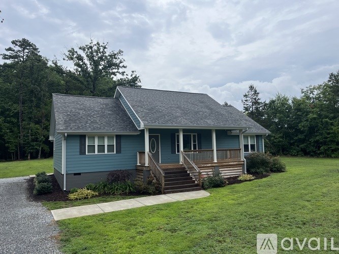 A house with a blue exterior is for sale.