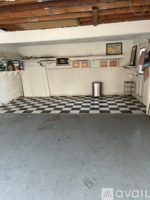 A checkered black and white floor in a room.