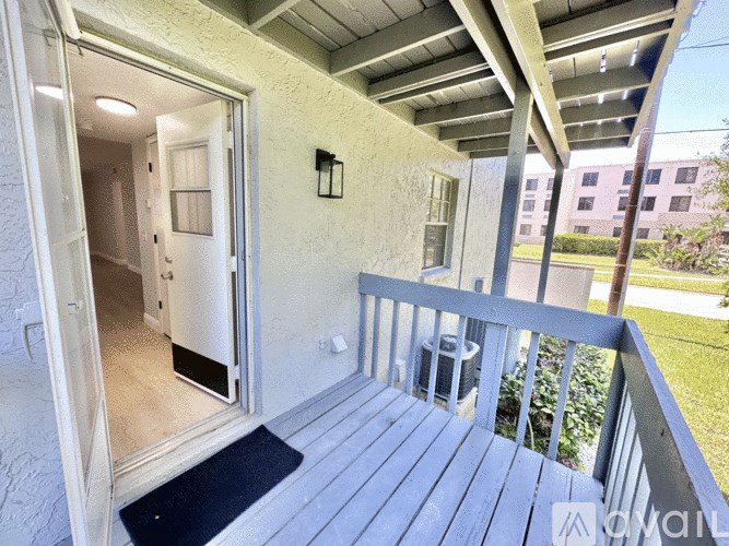 A balcony with a door and a railing.