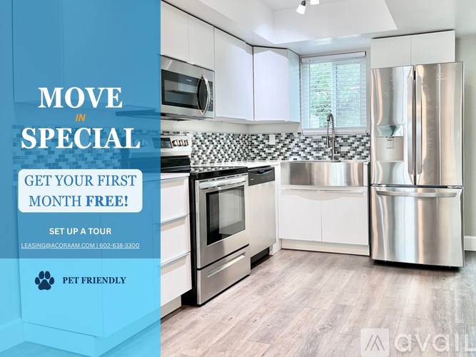 A modern kitchen with a promotion for a free first month for a tour.