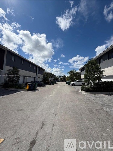 A sunny day at the parking lot with a clear blue sky.