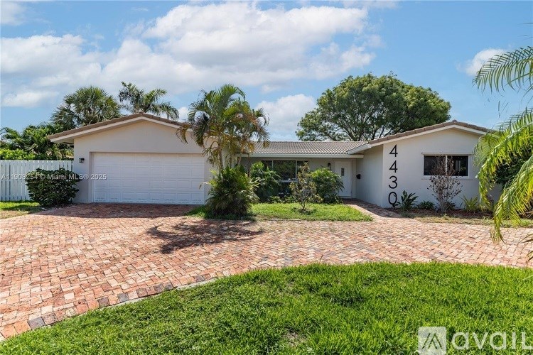 A house with the number 4430 on its side is for sale.