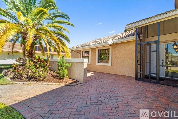 A house with a palm tree in front of it.