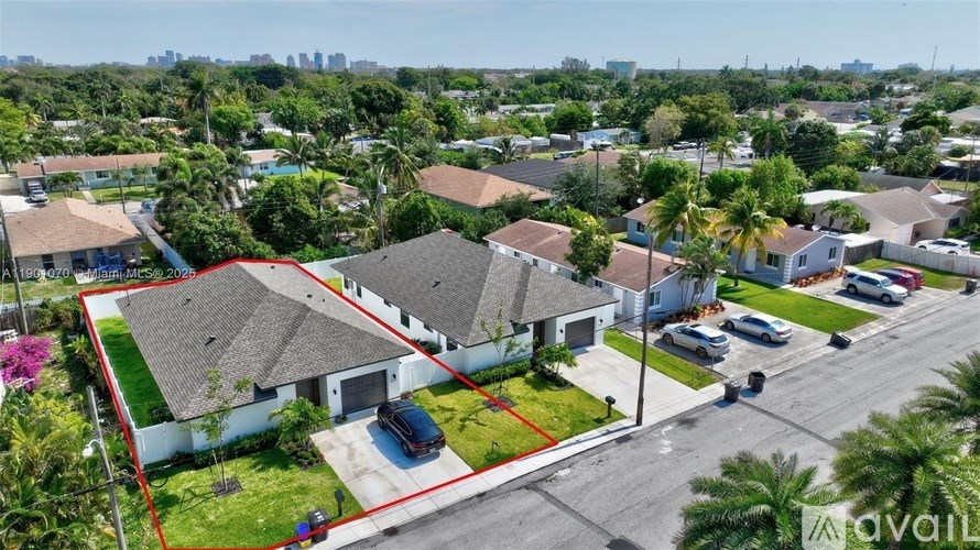 A bird's eye view of a residential area with houses and streets.
