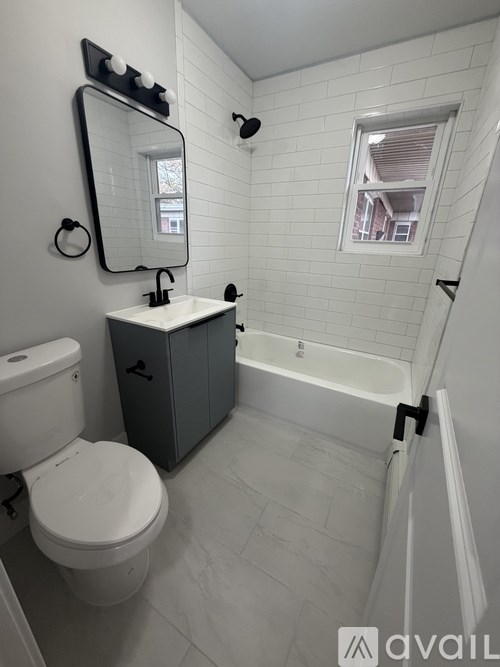 A white toilet sits next to a sink in a bathroom.