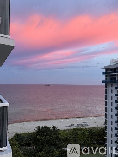 A view of a beach from a high-rise building.