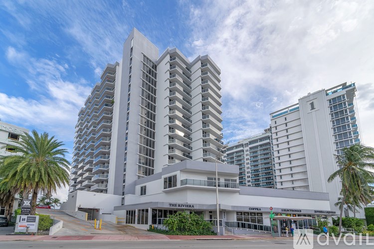 The Riviera hotel is a large, modern building with a lot of windows and balconies.