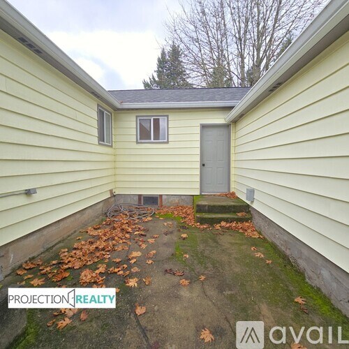 A small house with a grey door and a grey window.
