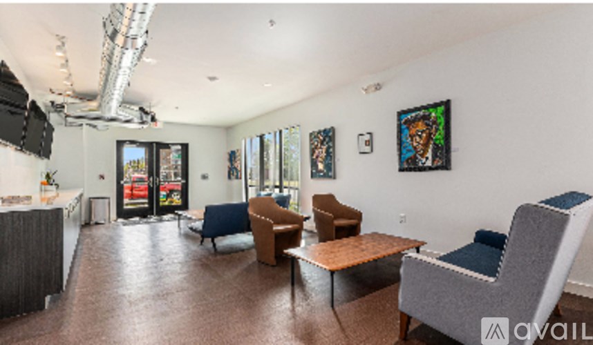 A living room with a grey couch and a brown coffee table.