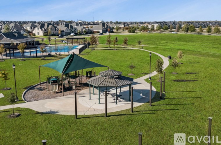 A park with a playground, a pavilion, and a pool.