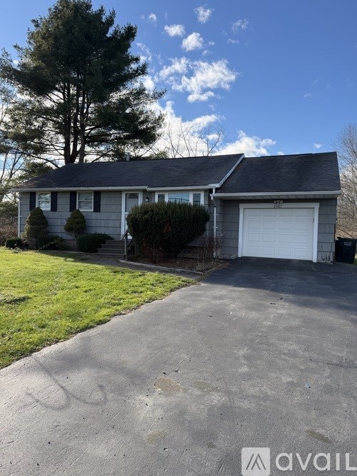 A house with a driveway in front of it.