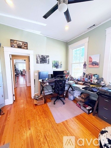 A room with a desk and a computer.