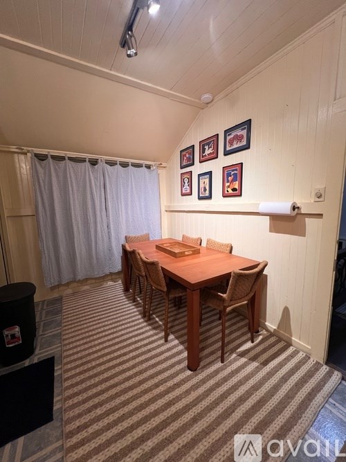 A conference room with a long table and chairs.