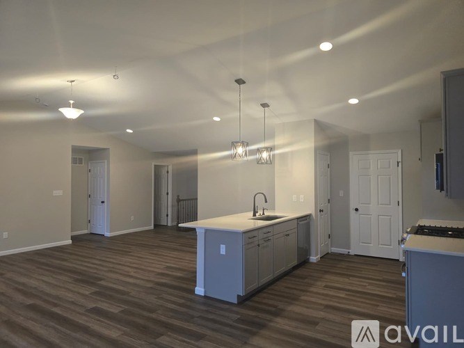 A spacious kitchen with a large island and modern appliances.