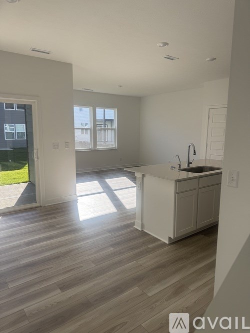 A kitchen with a sink and a window.