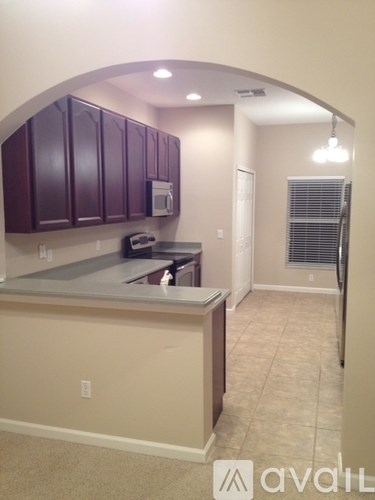 A kitchen with purple cabinets and a counter.