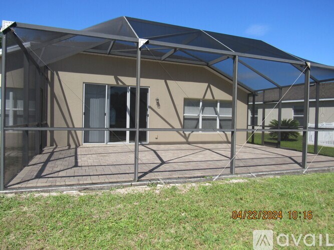 A building with a glass roof and a metal fence.